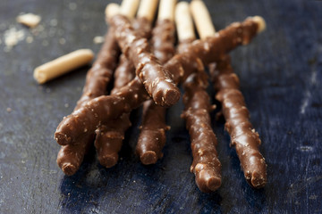 chocolate sticks on a wood background