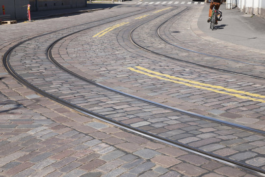 Tram Tracks with Cyclist in Helsinki,