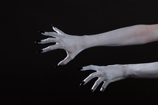 Scary pale ghost hands with black nails