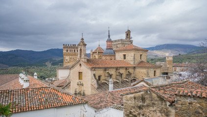 Fototapeta premium Royal Monastery of Santa Maria de Guadalupe, cloudy sky