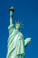 Fototapeta premium Statue of Liberty on blue clear sky, New York City, USA