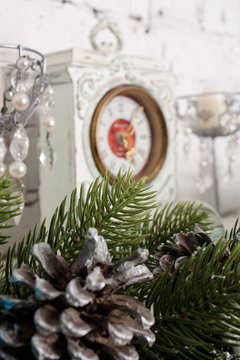 Christmas decorations on a background of the old clock