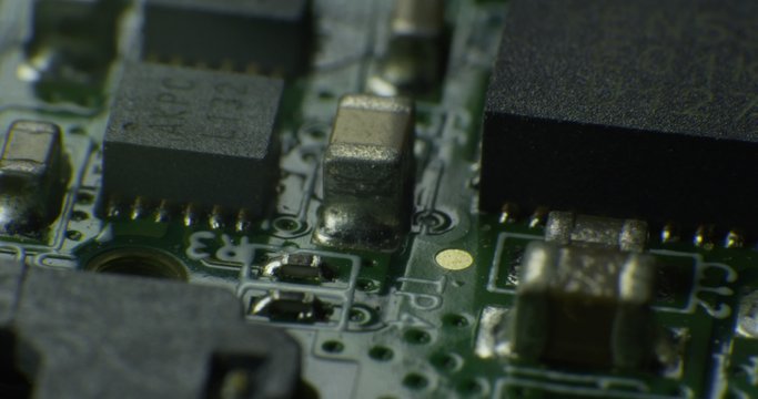 Macro shot on technology circuit board rotating. 4K