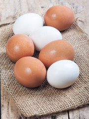  eggs on a wooden surface