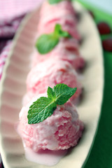 Watermelon ice cream in bowl  on color wooden background