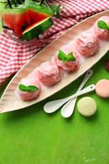 Watermelon ice cream in bowl  on color wooden background