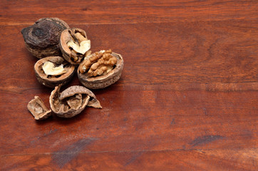 Walnuts on teak surface