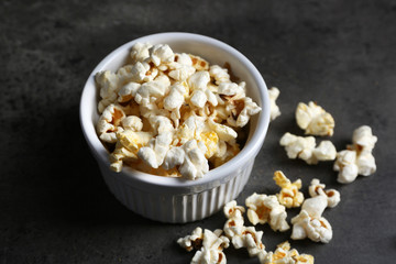 Popcorn in bowl on dark background