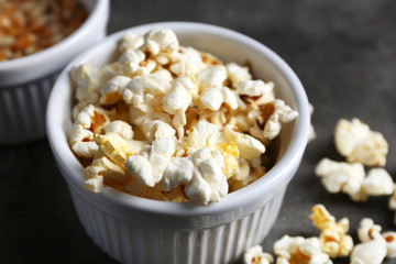 Popcorn in bowls on dark background