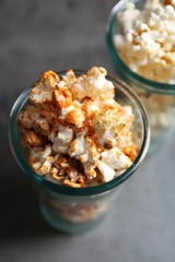 Popcorn in glasses on dark background