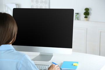 Woman working with computer in office