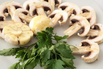 Can of raw mushrooms with garlic and parsley.