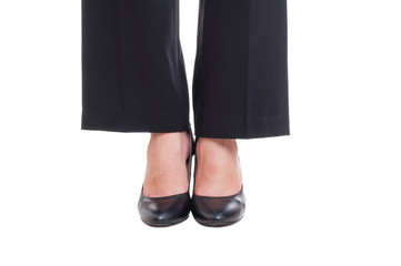 Close-up of business woman feet wearing black shoes standing tog