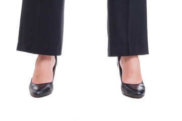 Close-up of business woman feet wearing black shoes standing spr