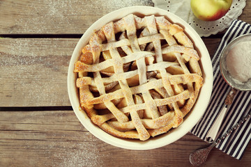 Homemade apple pie on wooden background