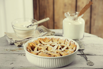 Homemade apple pie on wooden background