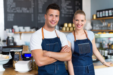 Couple working at coffee shop