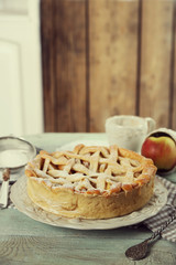 Homemade apple pie on wooden background