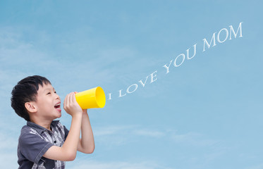 Little Asian boy speaking "I love you mom" via yellow cup