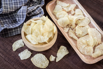 potato chips on wooden background