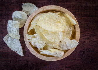 potato chips on wooden background