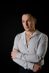 A man posing in the studio.  Young businessman 