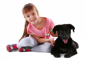 Little cute girl with puppy isolated on white