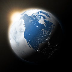 Obraz na płótnie Canvas Sun over North America on planet Earth
