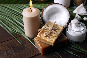 Spa coconut products on dark wooden background