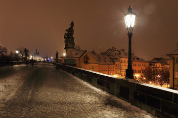 Naklejka premium Night snowy Prague Charles Bridge