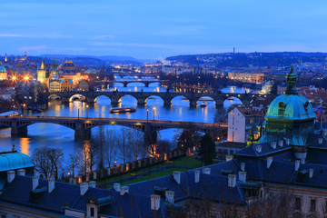 Fototapeta na wymiar Colorful evening Prague City with its Bridge sabove River Vltava, Czech Republic 