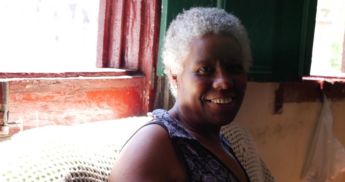 Brazilian Woman Smiles inside of aa Typical House in Ouro Preto, Minas Gerais, Brazil