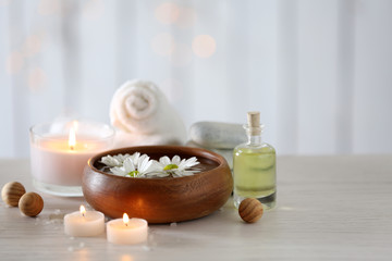 Beautiful composition of spa treatment on wooden table