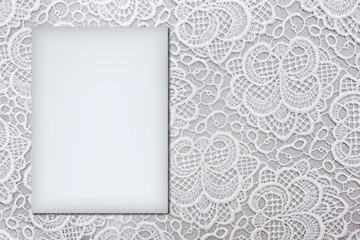 White horizontal lace background closeup with copy space