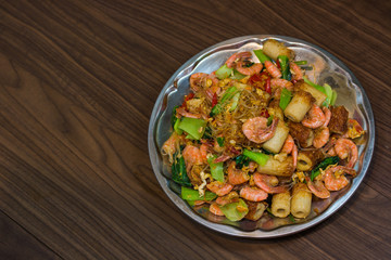 Shrimp fried vermicelli and vegetables close-up on the table/ to