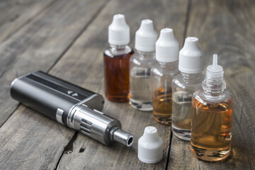 e-cigarettes with different re-fill bottles - obrazy, fototapety, plakaty