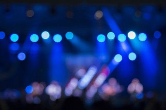 Defocused stage lights and crowd on a concert     