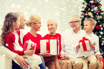 smiling family with gifts at home