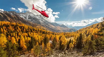 Fototapeten Helikopter im Flug über das Val di Campo - Schweiz © Silvano Rebai