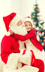 smiling little girl with santa claus