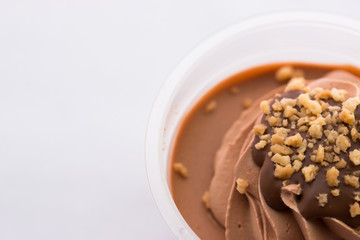 Ice cream chocolate in transparent plastic cups.