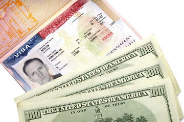 Fototapeta na wymiar The American visa on page of the Russian international passport and US dollars..