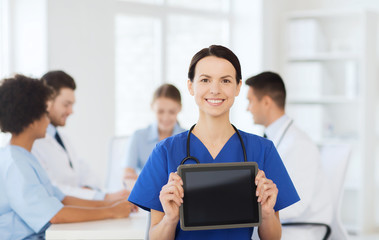 happy doctor over group of medics at hospital