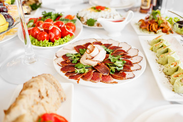 Mixed food on banquet table.