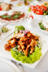 Mixed food on banquet table.