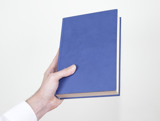 blue book in hand