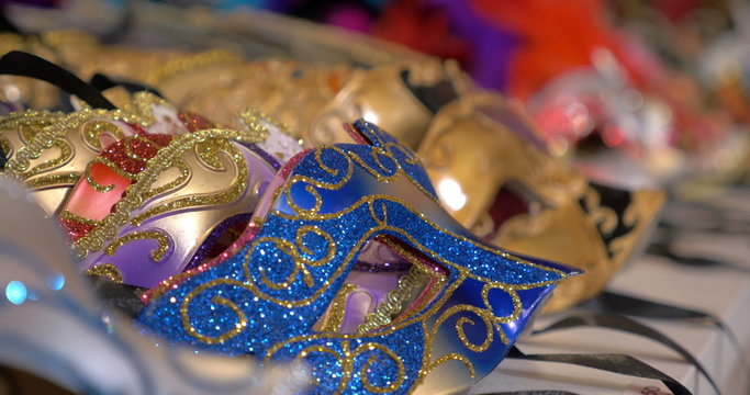 Colorful Venetian masks on the shop counter