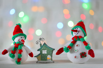 Cute snowmen on Christmas background