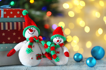 Cute snowmen on Christmas background