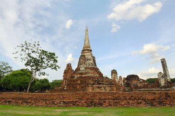 Fototapeta premium Old buddha pagoda temple with cloudy white sky in Thailand